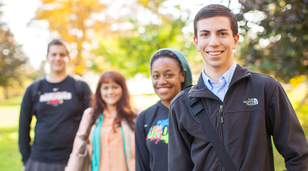 Group of La Roche students standing outside on a fall day